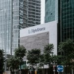 a tall building with a sign in front of it