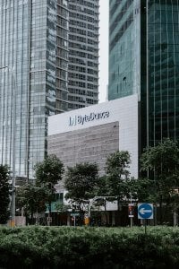 a tall building with a sign in front of it